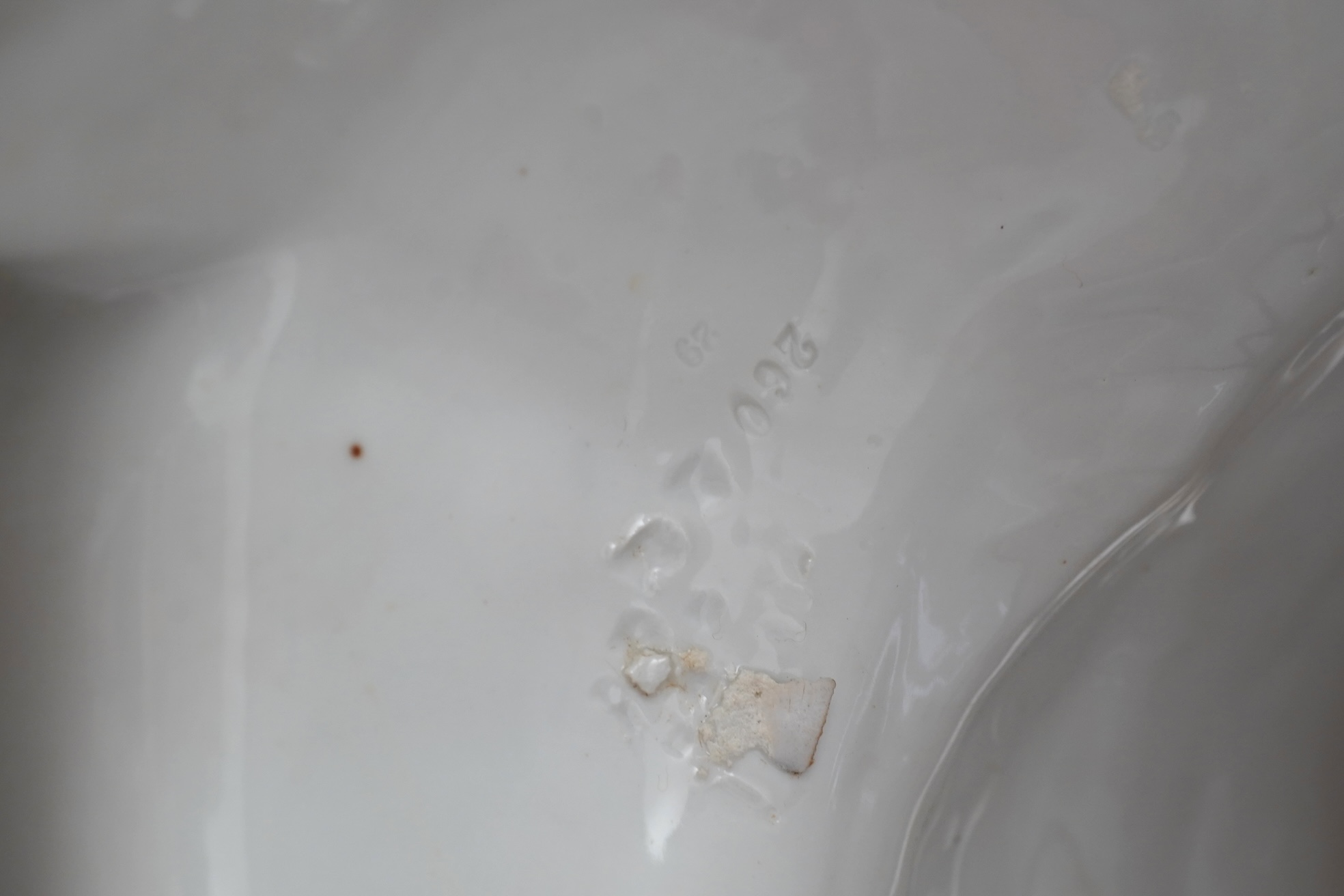 A large Continental porcelain figure of a seated nodding Buddha, early 20th century